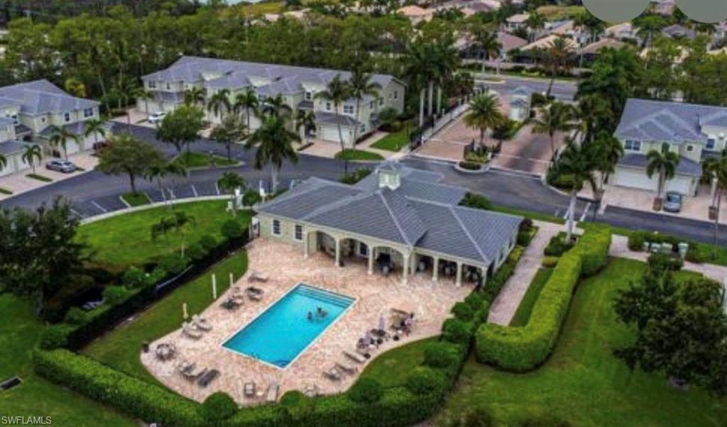 View of property location featuring nearby suburban area and a pool