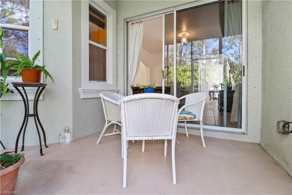 Sunroom featuring a patio
