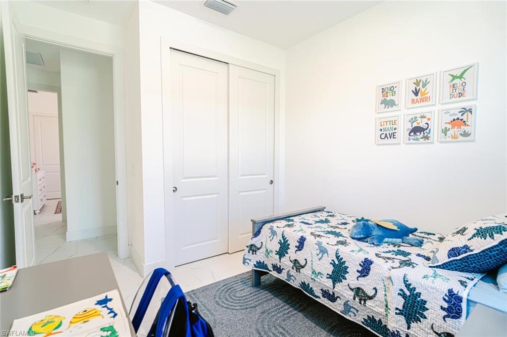 Recessed lighting illuminating the room with neutral wall finishes