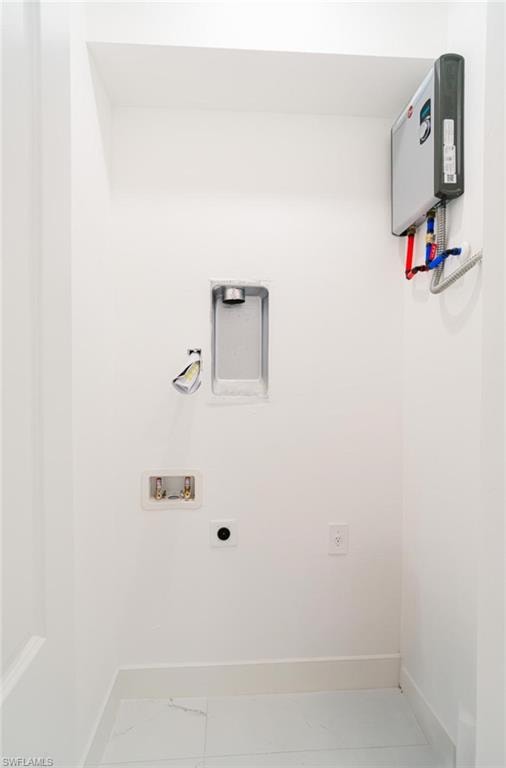 Dedicated utility space featuring a tankless water heater, white tile flooring, and clean white walls