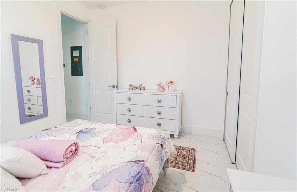 Room featuring white walls and white tile flooring