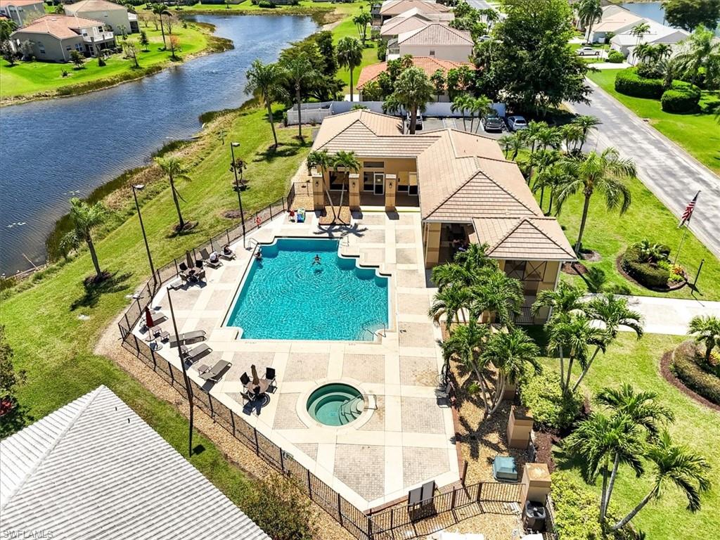 Drone / aerial view with a residential view and a water view