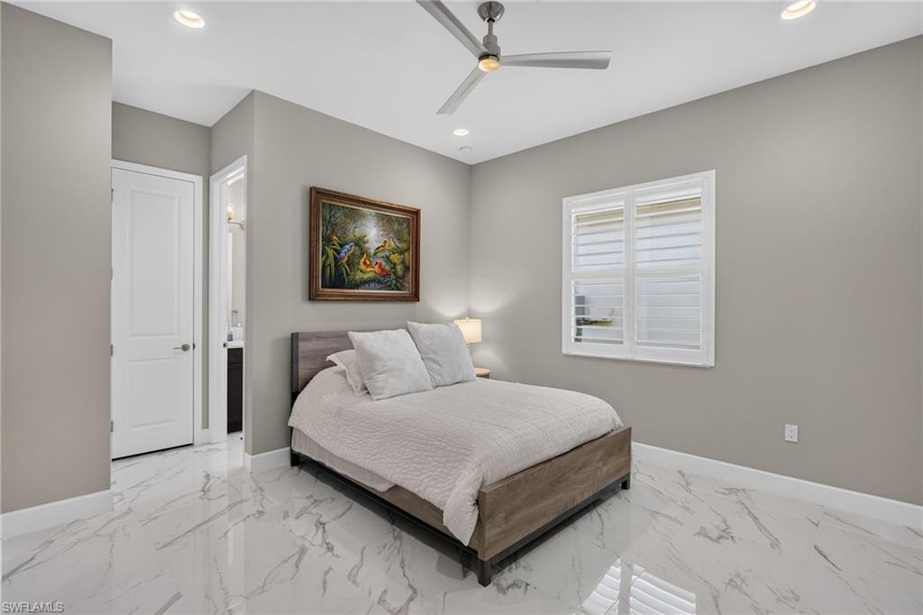 Interior room featuring large format marble-look tile flooring