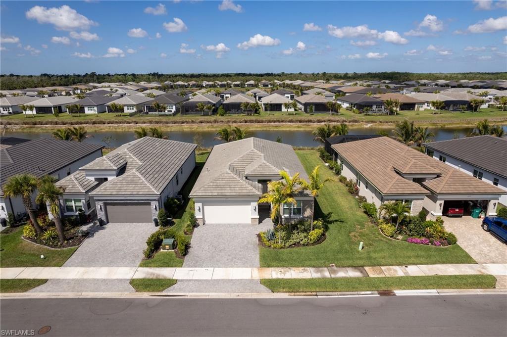Aerial perspective showcasing a residential community with numerous single-story homes