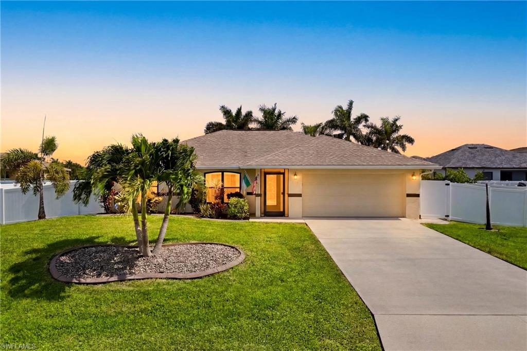 Turnkey furnished and move-in ready, this beautifully maintained Southwest Cape Coral home sits on a rare fenced triple lot offering exceptional privacy and curb appeal.