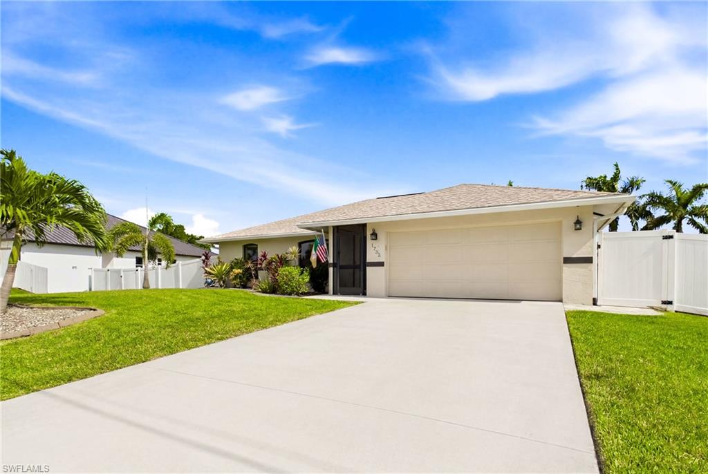CURB appeal with an extended front yard, lush grass, professional curbing, mature landscape a dream both inside and out.
