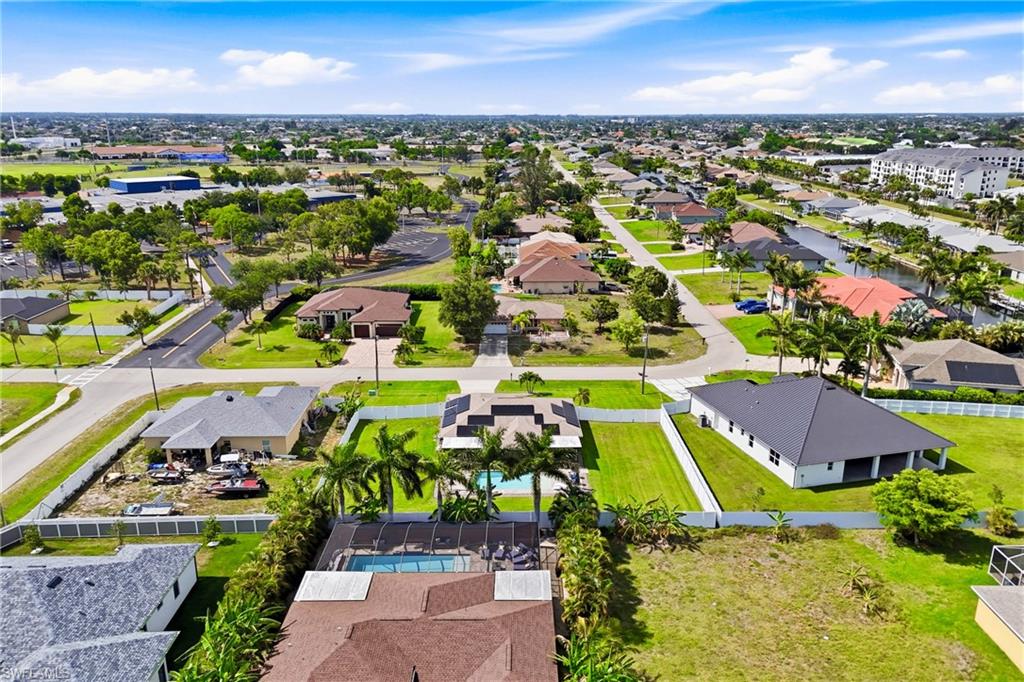 Stunning aerial of the backyard capturing the generous outdoor space surrounded by mature landscaping, creating a private and peaceful retreat.