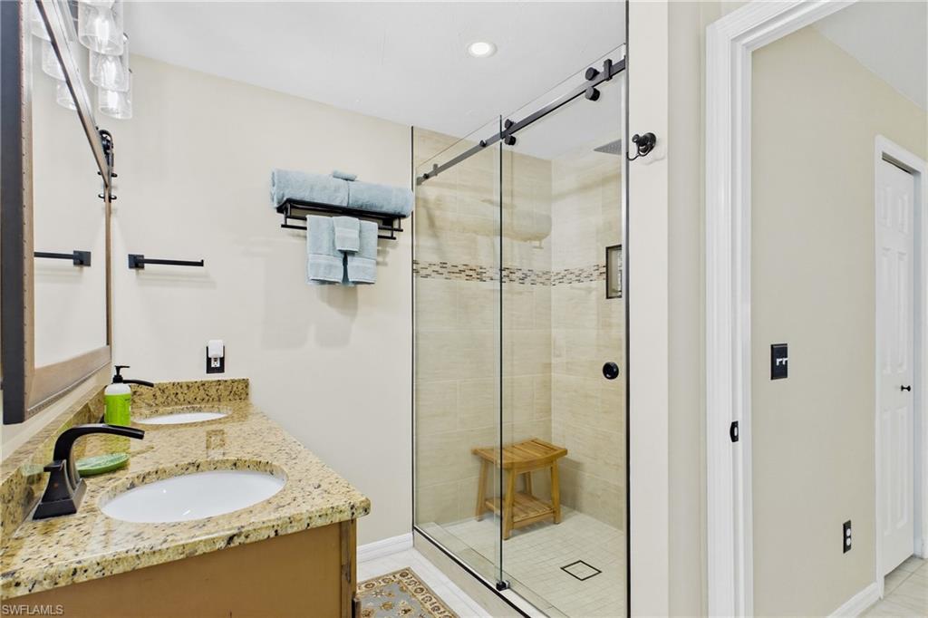 Master bathroom was very tastefully redone and is beautiful and a spa like retreat. Dual sinks upgraded fixtures and a large walk-in shower with sliding glass shower door.