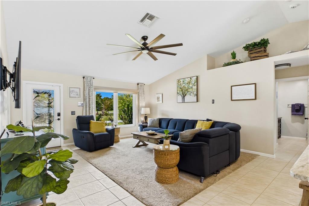 Designed for comfort and peace of mind, this inviting living area showcases beautiful impact windows and an open-concept layout.