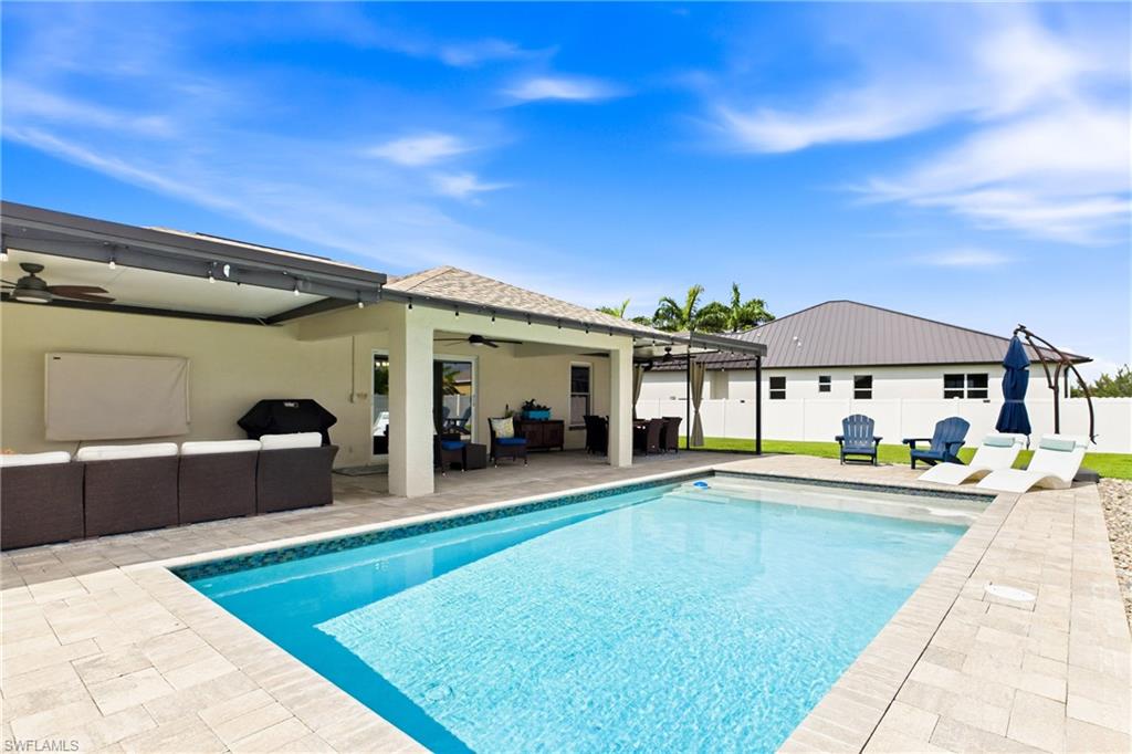 View of the sparkling pool - with a nice sun shelf and plenty of pavers for loungers!