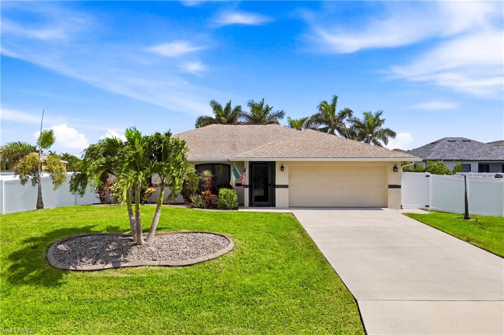 Front exterior of the home featuring the main entrance, driveway approach, and surrounding landscaping.