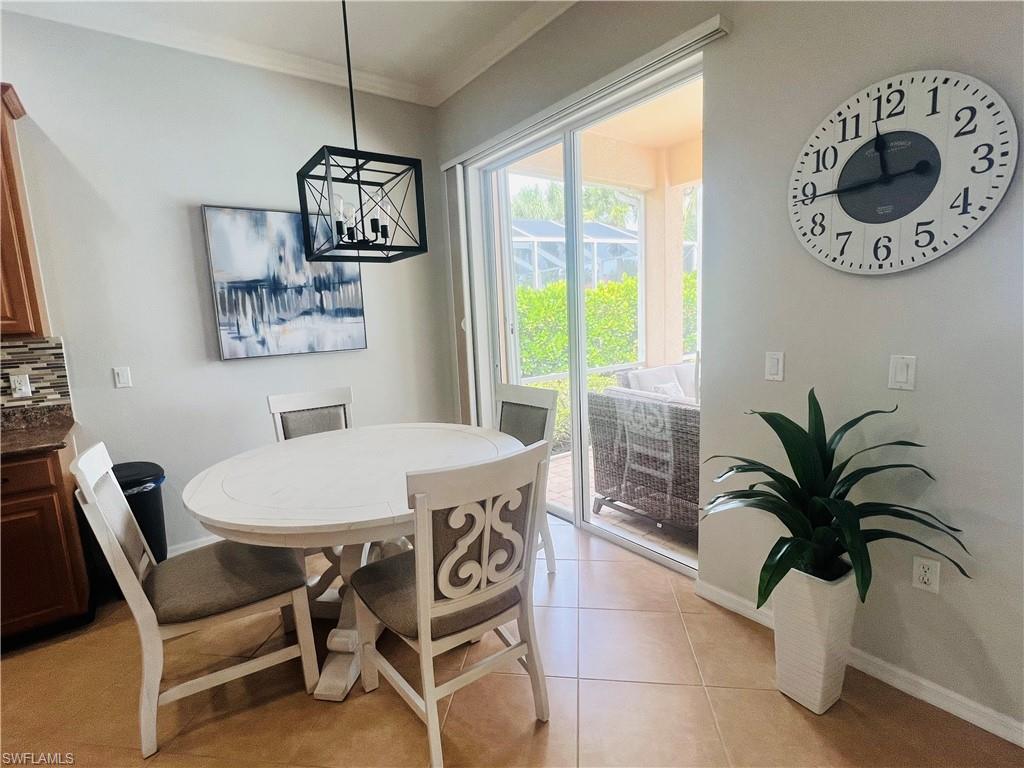 Tiled dining space with ornamental molding