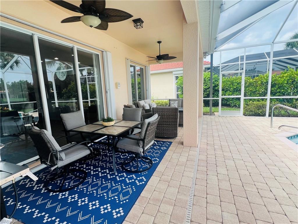 View of patio / terrace featuring an outdoor hangout area, ceiling fan, and a lanai