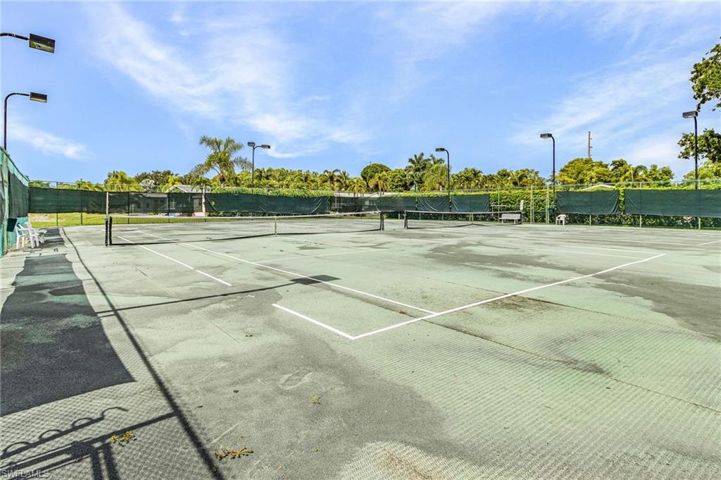 Two hard-surface tennis/pickleball courts featuring perimeter fencing.