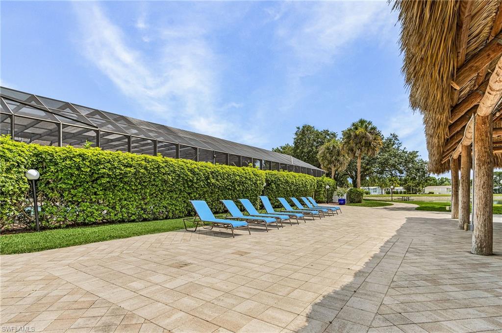 Lounge chairs near covered pavilion.