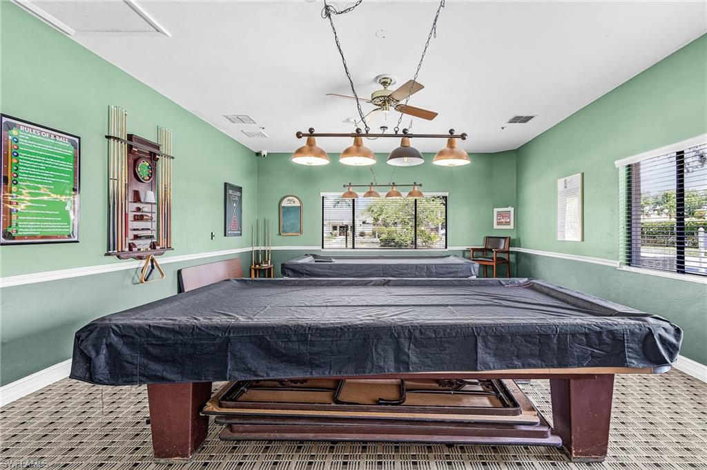 Recreation room featuring two billiard tables.