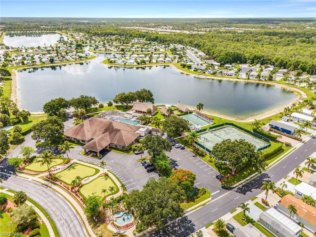 Aerial perspective showcasing the clubhouse with a central 60 acre lake.