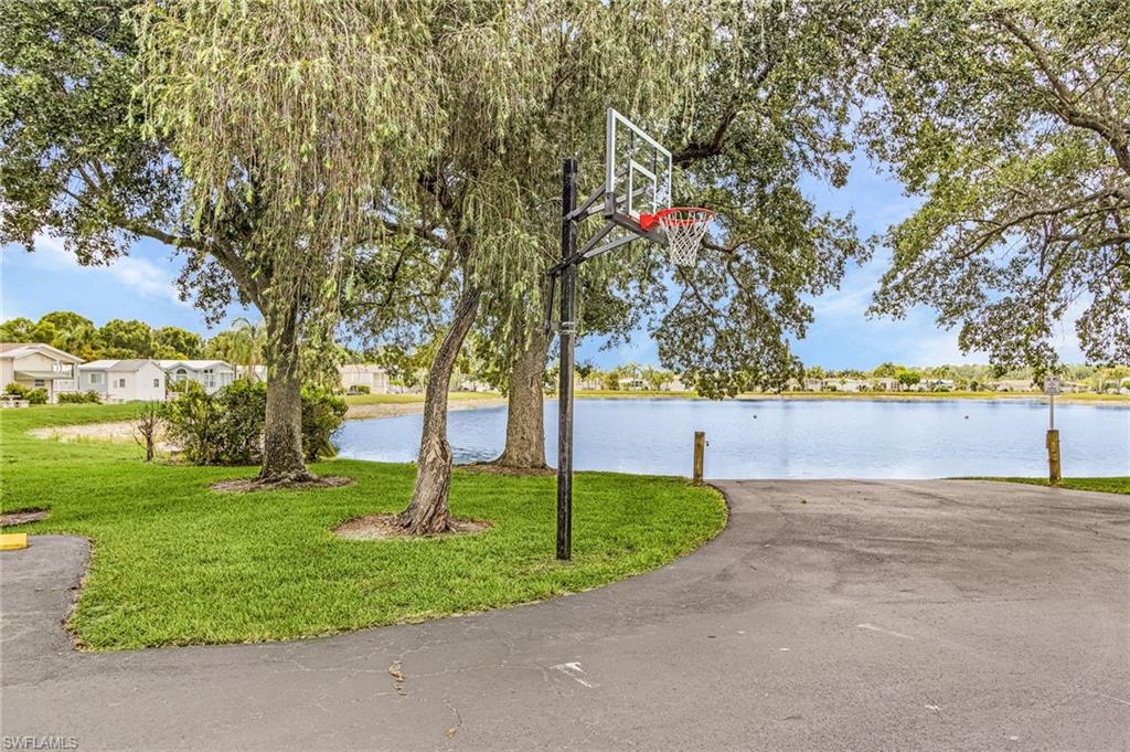 Basketball hoop near clubhouse.
