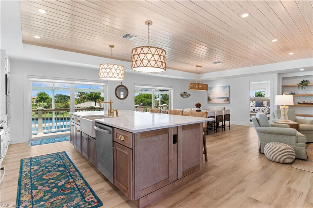 Open-concept living space with shiplap ceiling details