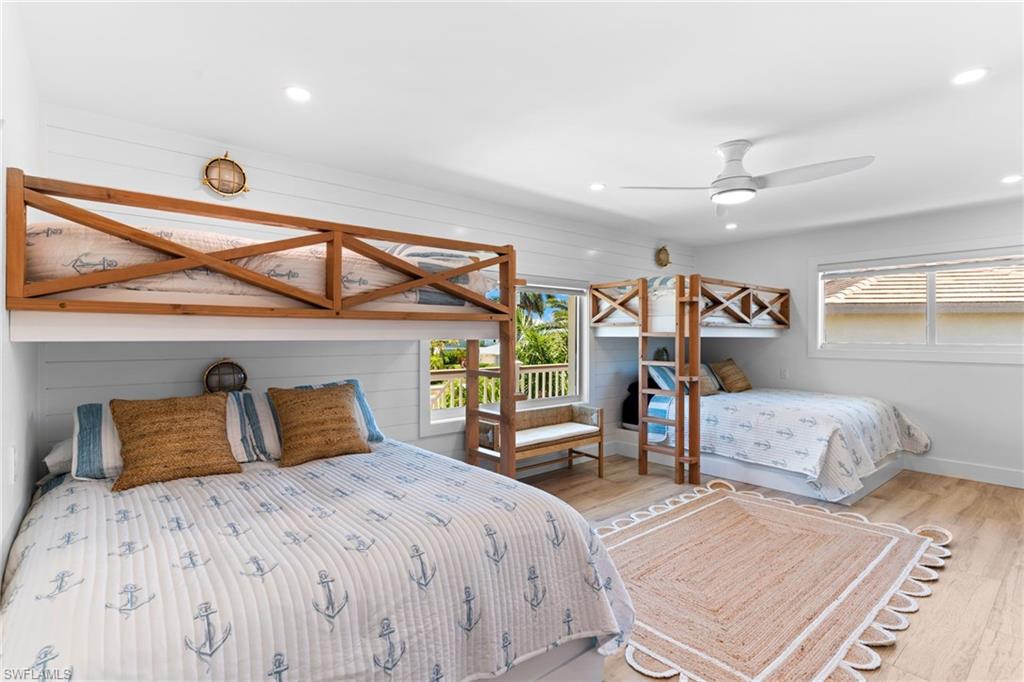Bright room with wood-finish flooring and integrated bunk beds