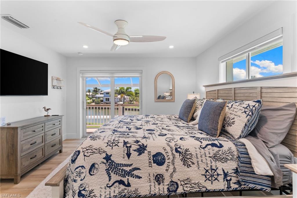 Bright interior featuring light wood-finish flooring and white walls