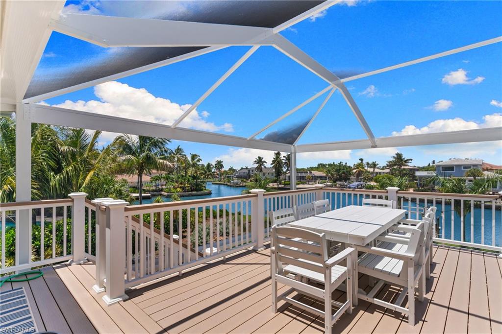 Expansive outdoor deck featuring composite decking and a screened-in enclosure