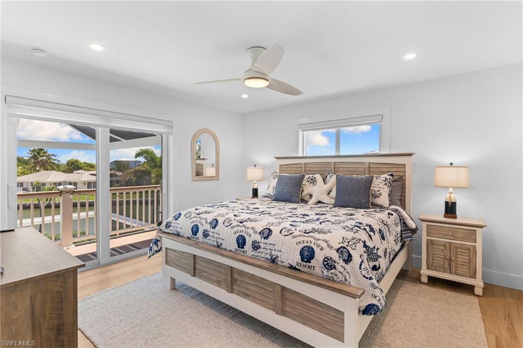 Room featuring light wood-finish flooring, white walls, and recessed lighting