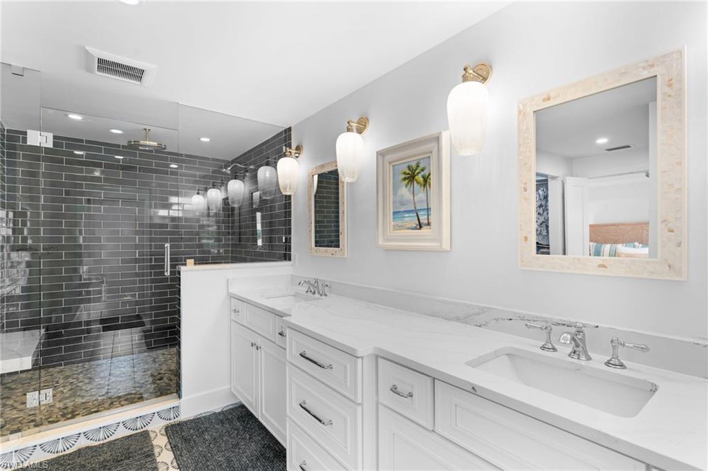 Dual vanity with integrated sinks and white countertops