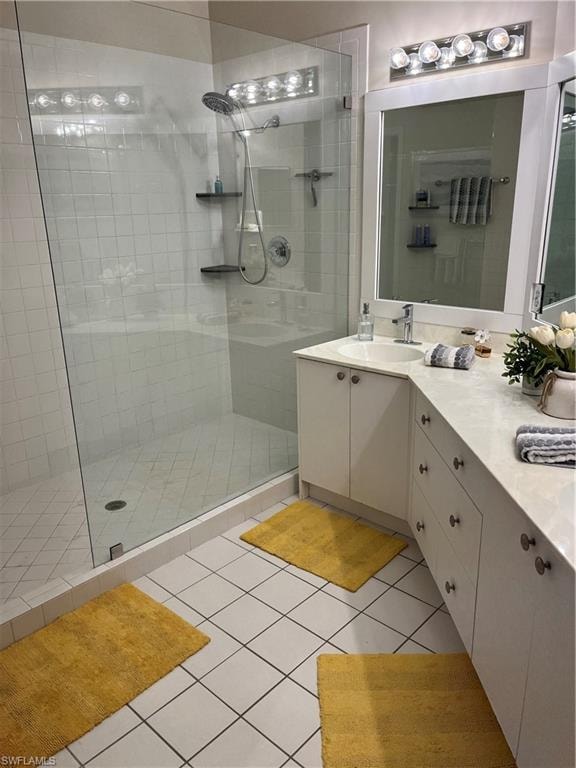 Bathroom featuring a glass-enclosed shower with white tiled walls and a dual-head shower system