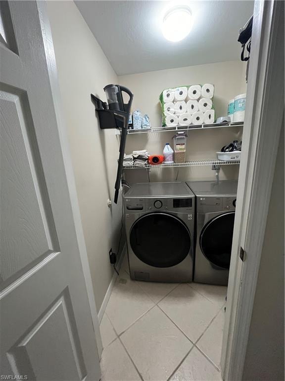 Laundry area featuring tile flooring, neutral wall paint, overhead lighting, and wire shelving