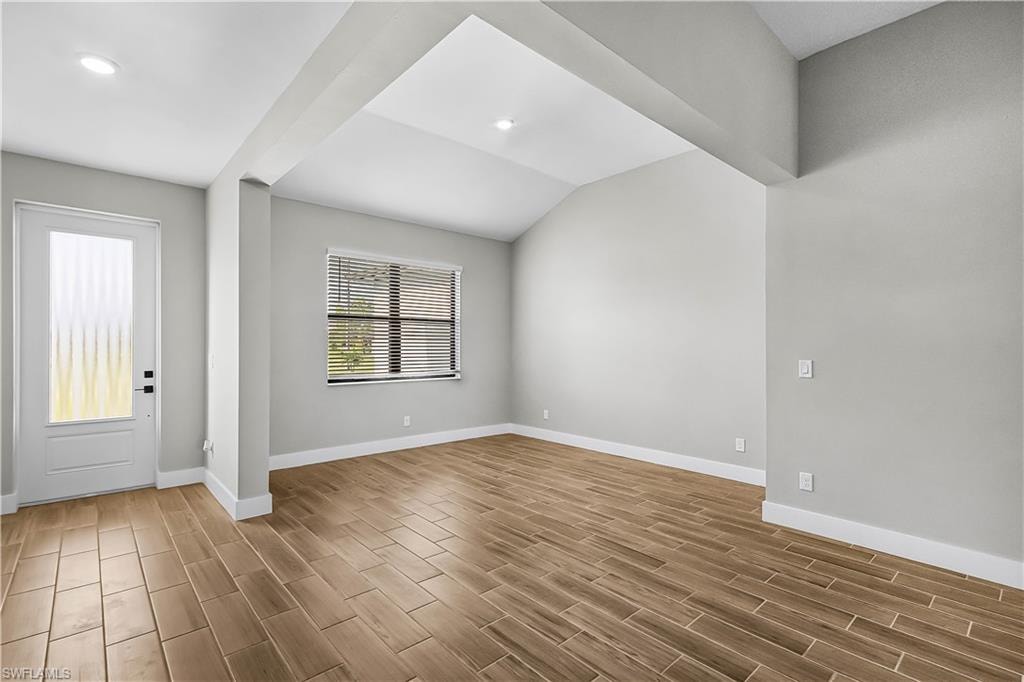Foyer featuring wood tiled floors and recessed lighting