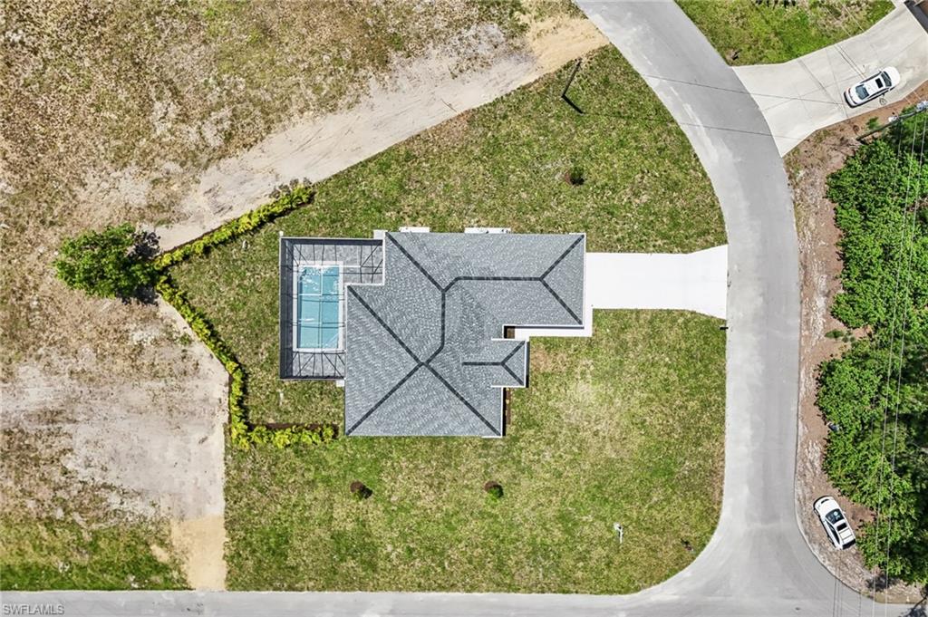 Aerial perspective showcasing a single-story residence with a gray shingle roof