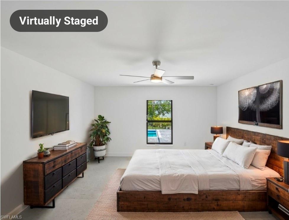 Bright room featuring light-toned walls and polished concrete flooring