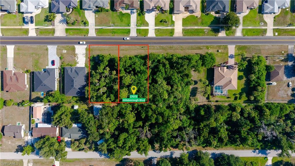 Vacant land parcels featuring mature trees and street frontage