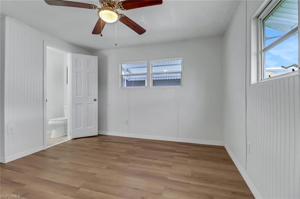 Primary Bedroom with Luxury Vinyl Plank Flooring
