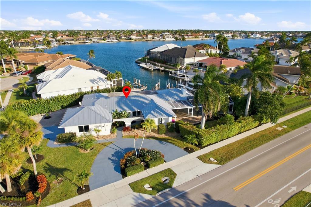 Aerial perspective of suburban area with a large body of water