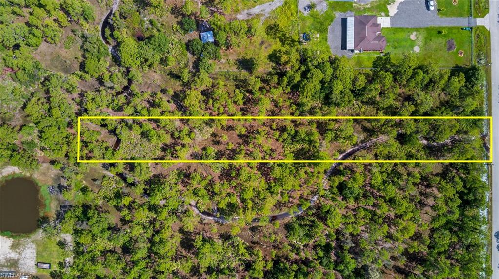 Aerial overview of property's location featuring property parcel outlined