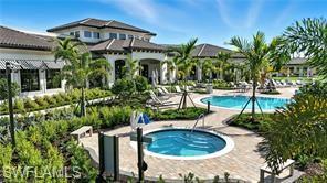 Community pool with a community hot tub and a patio area