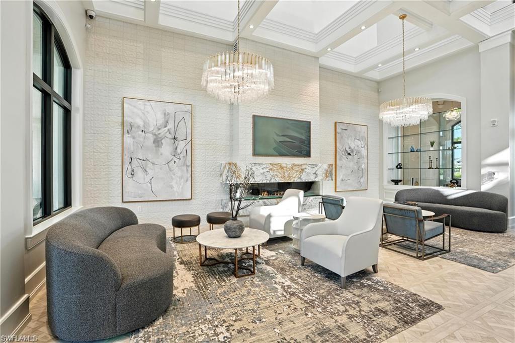 Building lobby with a towering ceiling, beam ceiling, and coffered ceiling