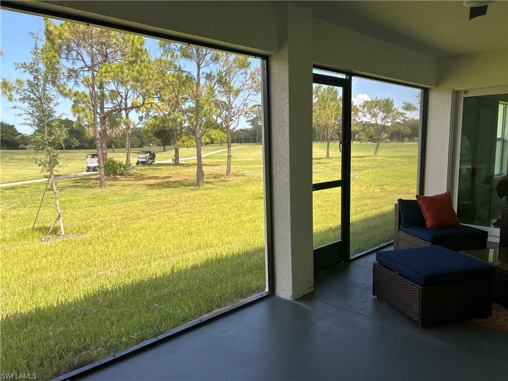 Screened-in patio with concrete flooring