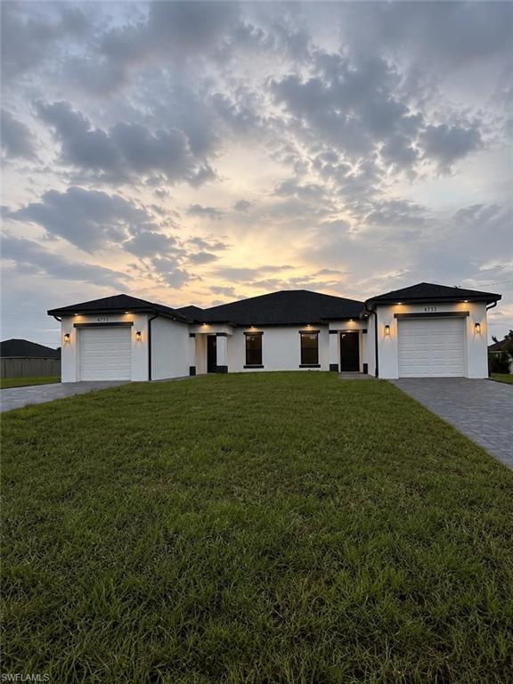Modern exterior with white stucco finish and black trim