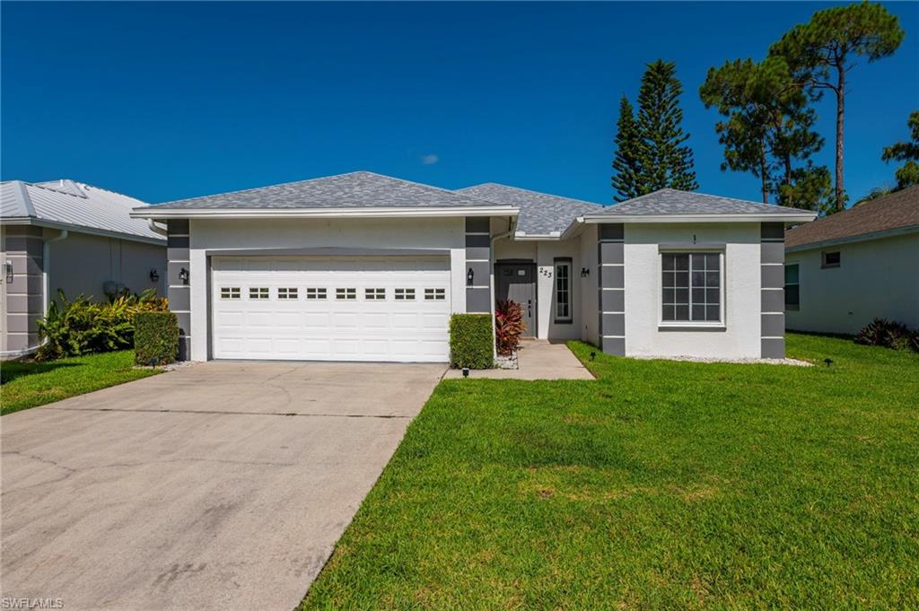 White stucco exterior with gray architectural accents