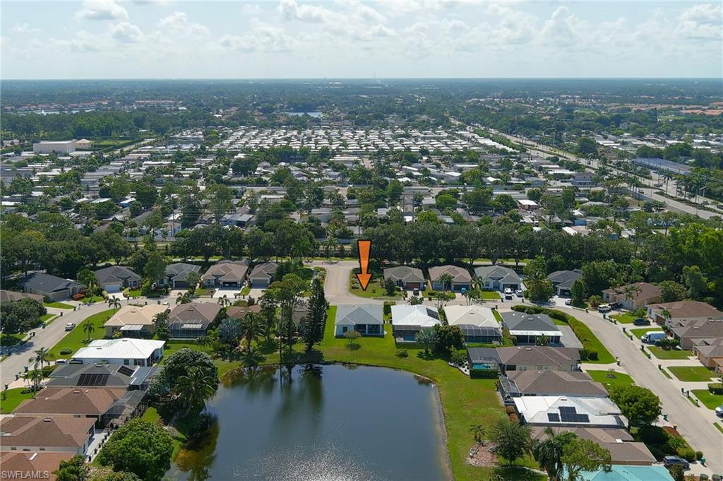 Aerial perspective showcasing a residential area with varied home styles and mature landscaping