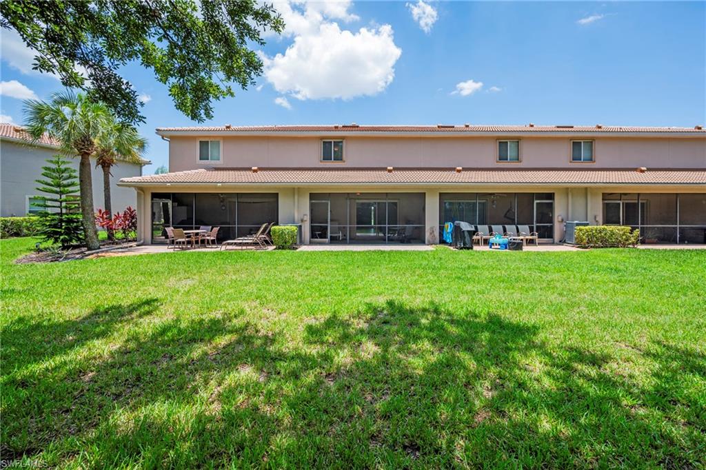 Expansive green lawn with mature landscaping