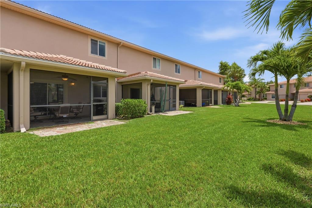Expansive green lawn bordering residential structures