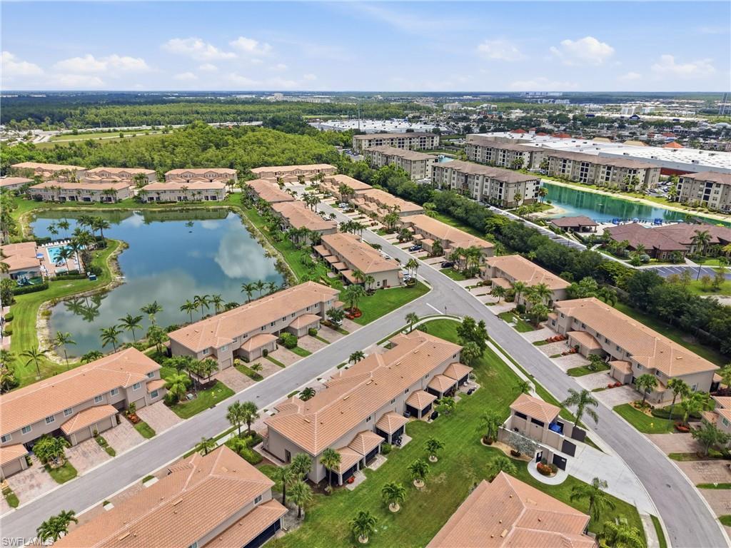 Aerial perspective showcasing a residential community with terracotta-style roofs