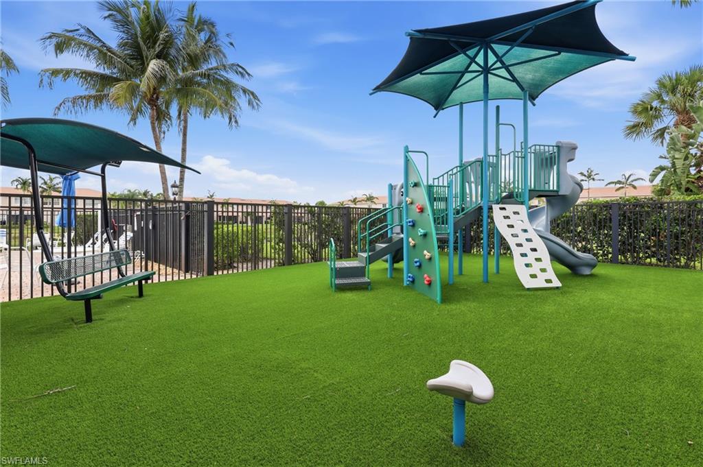 Dedicated play area featuring a multi-level playground structure with slides and climbing walls