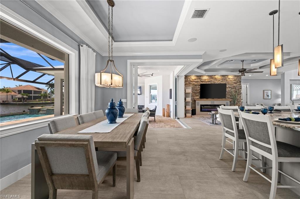Dining room just steps to the lanai through the 90 degree sliding doors