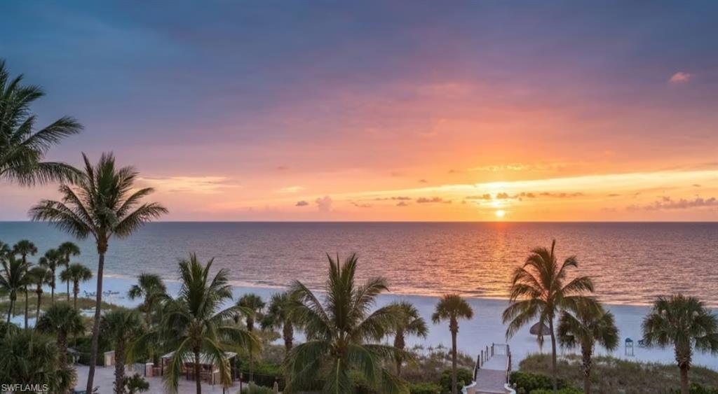 Expansive ocean scenery with a vibrant sunset and sandy beach