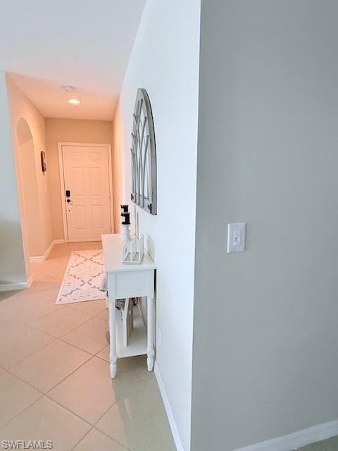 Front entryway features clean tile floors and details like the decorative console.